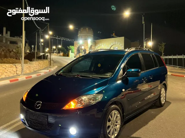 مازدا 5 جير عادي 6+1 متور 2000 بنزين رخصه و تامين جديد عداد قليل فحص نخبب سعرر كااششش