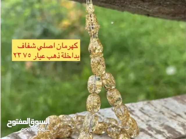 كهرمان اصلي شفاف بداخله ذهب