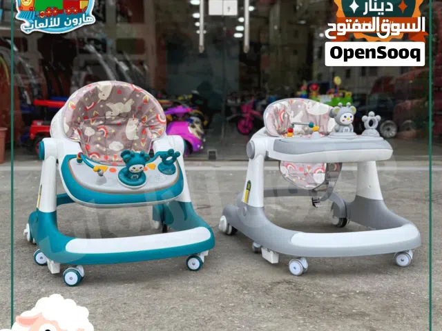 كراجة / عربة تعليم مشي ونطاطه و شمسية و وكر و يد للدفع وموسيقى نخب اول من المصنع مباشره ......