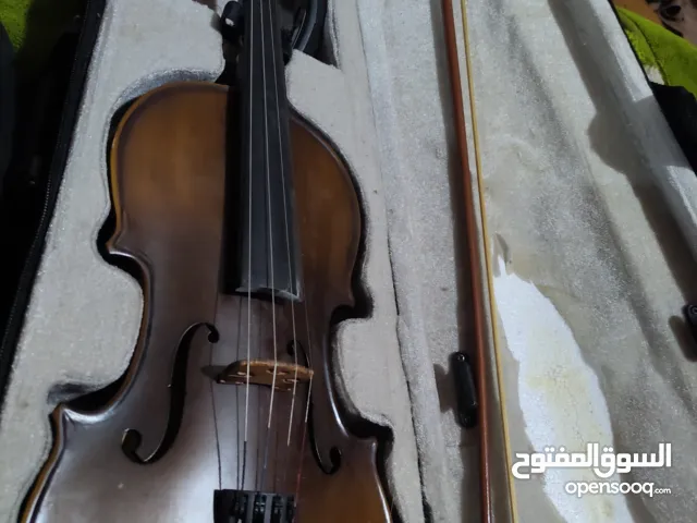 كمان جديد اصلي خشبي مع ستاند كتف وحقيبة خاصه ب200.000اف بيه مجال