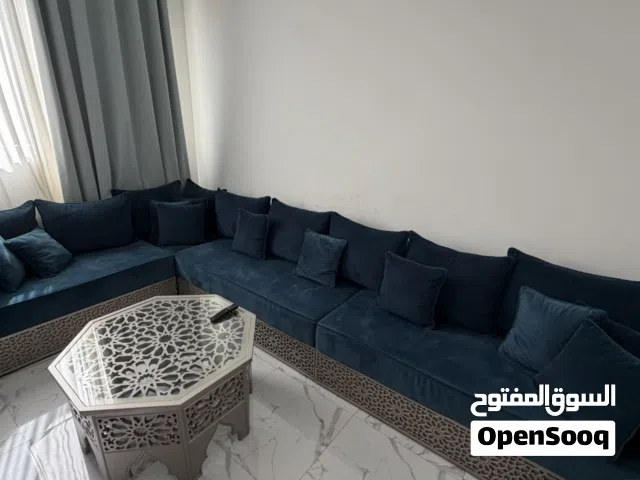 Couch, coffee table, blinds and carpet