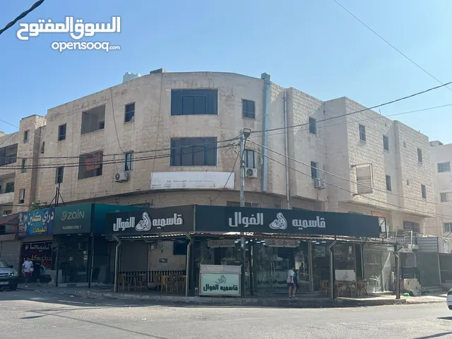 مجمع تجاري محلات وشقق مع تسوية