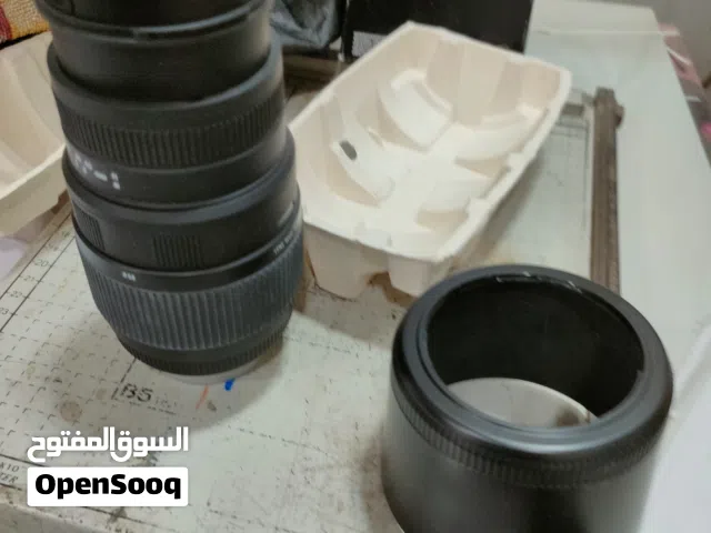 زوم كامرة 300*70 نيكون مع لدات ثلاثي الفيشة لون ثلجي