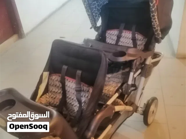 عربانة اطفال توأم 15 دينار بحاله جيده جدا