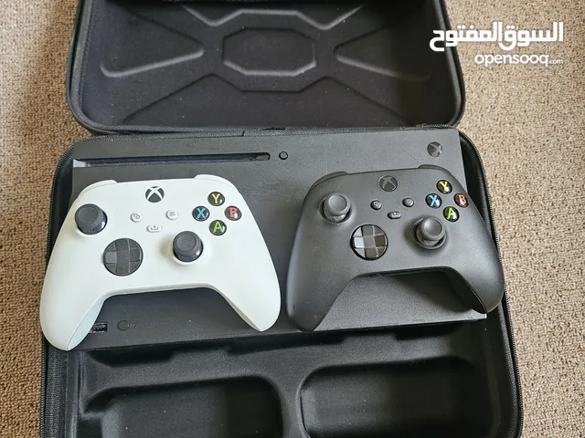 Xbox Series X with two controllers and case