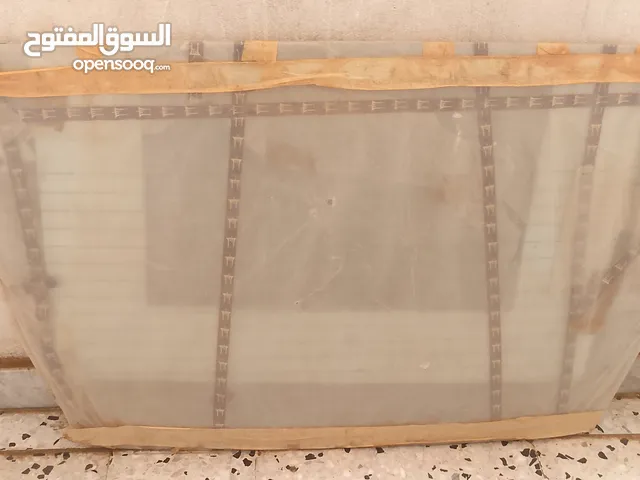 زجاج امس لسيارة مازدا 323