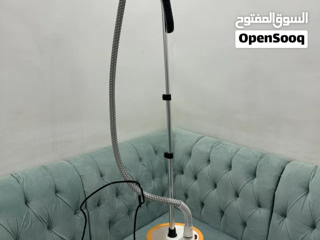 مكواه بخار وجهاز مساج للقدم