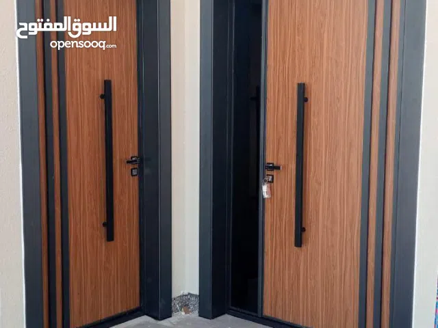 تفصيل وتركيب جميع انواع الابواب الالمنيوم وفايبر وفل الفايبر والابواب التركيه وUBVC