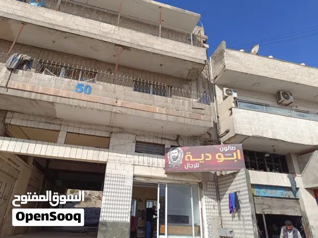 بسم الله عمارة للبيع اربع شقق مع خمس مخازن تقريبا شارع عمان الزرقا بالقرب من سامح مول قديما
