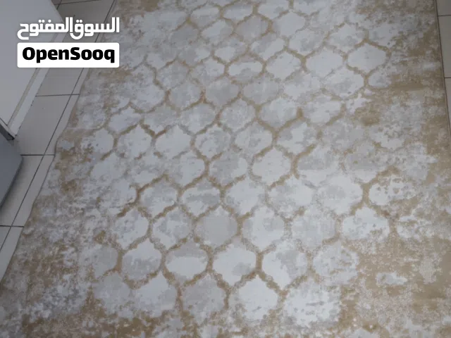 Light beige patterned area rug