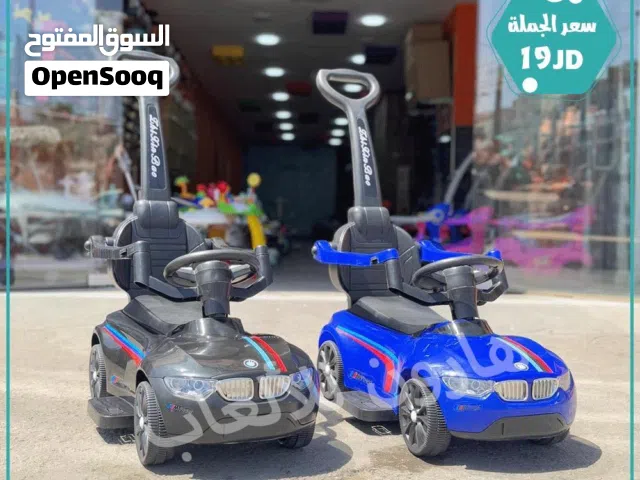سيارة دفع يد او قدم  مع حماي و موسيقى و اناره تناسب عمر 1 سنة الي 4 سنوات من المستورد مباشره