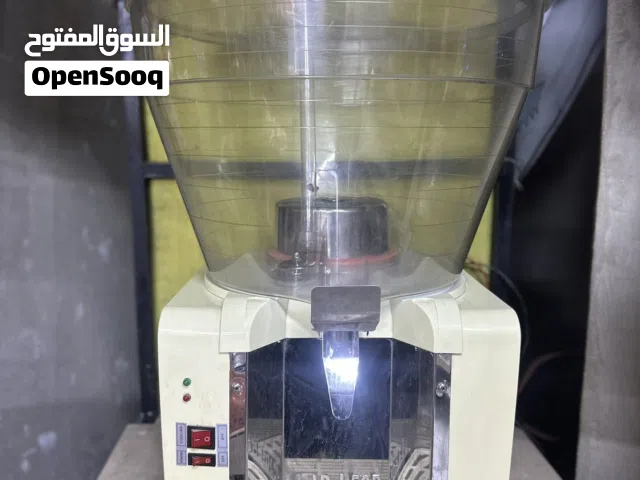 ماكينة تبريد عصائر + طاولة خاصة بها