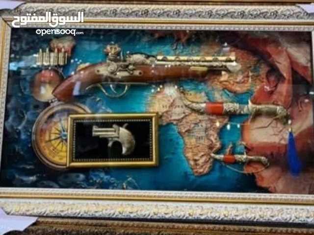 المسدس وأربعة قُلّ من القرآن