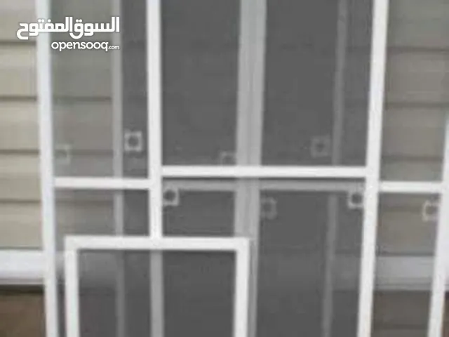 تركيب شبك الناموس وتفصيل أبواب وشبابيك المنيوم وتركيب حديد حمايه للشبابيك