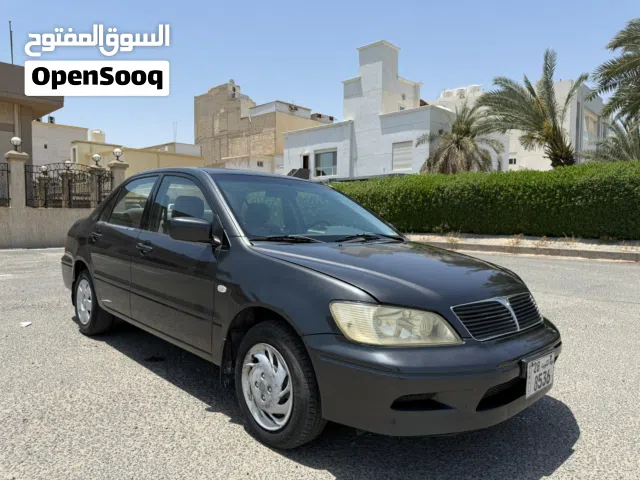 بحالة ممتازة ميتسوبيشي لانسر 2002مكيف بارد تواير نظيفة محركات نظيفة كل امورها تمام التواصل وتسااااب