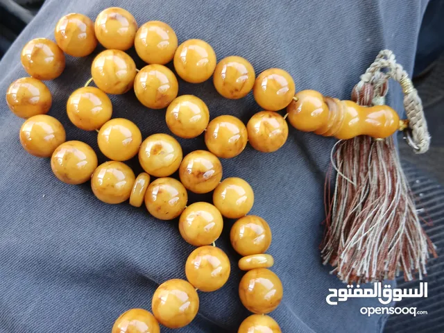 مسبحه كهرب كهرمان بالوني قديمه جدا مغلفه وزن تقيل 85 غرام جميله جدا جدا 85 عل خيط قديمه
