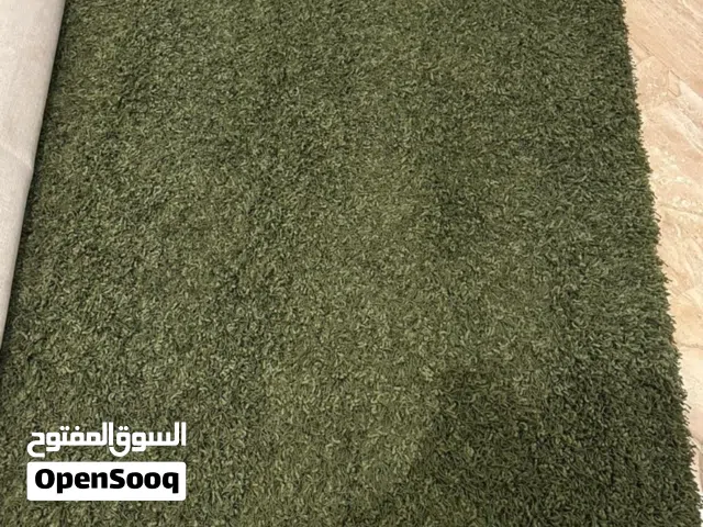 Dark green rug