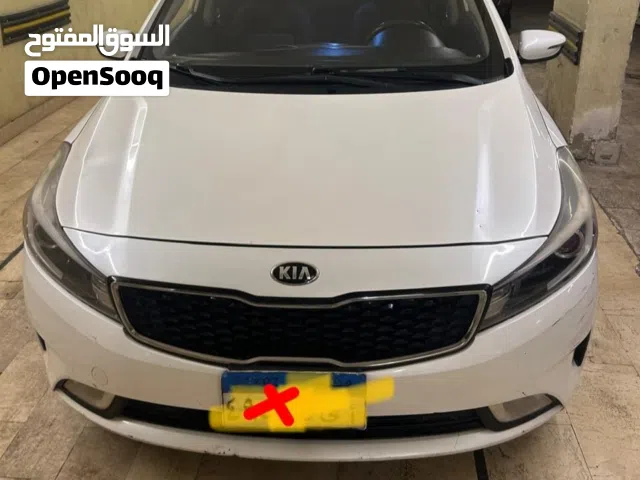 كيا سيراتو 2018 فابريكا عداد 216000 . اللون ابيض لؤلؤي