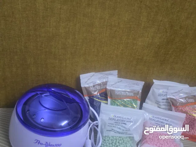 جهاز إزالة الشعر مع أكياس شمع جديده لم يتم استخدامها