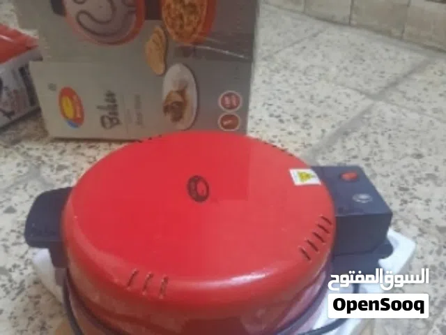 تنور كهربائي وصانعة كليجة