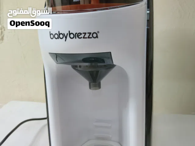 موزع حليب الأطفال برو أدفانسد من بيبي بريزا مع محضر الطعام تومي تيبي