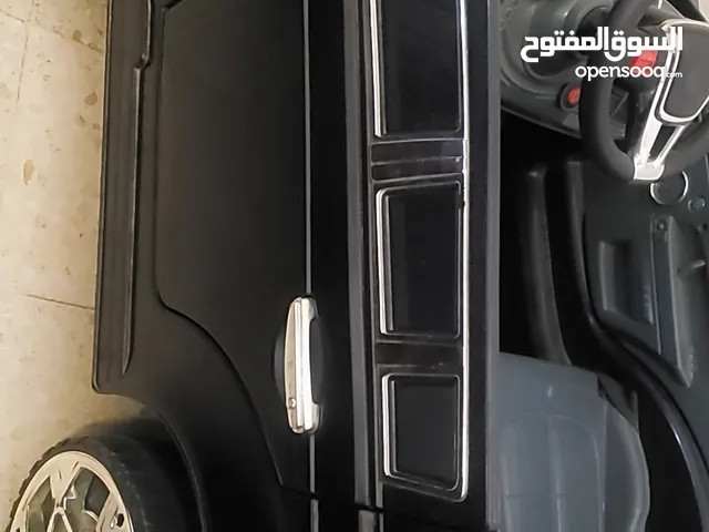"سيارة أطفال كهربائية 12 فولت – شحن – ريموت للوالدين – أبواب تفتح – LED وموسيقى-شاحن "