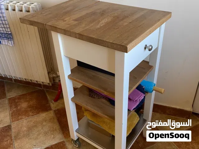 Mobile cabinet with cutting board drawers and shelves