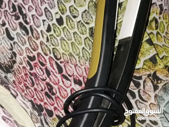 مكواة فرد الشعر