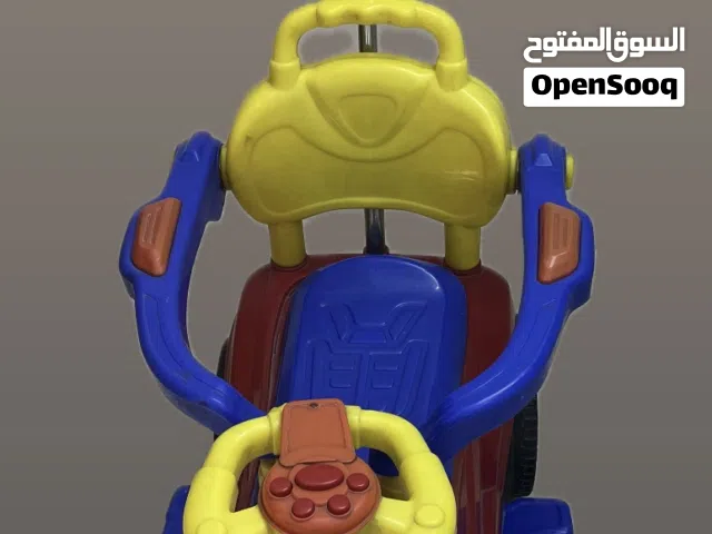 سيارة اطفال ام اليده الدفع