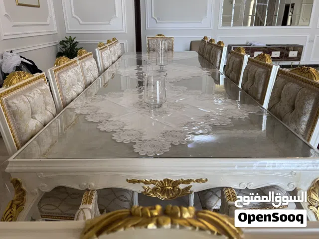 طاولة طعام 14 كرسي+طاولة بوفيه بست ابواب-القماش تركي والخشب زان-جديده لم تستخدم نهائياً-المطلوب12الف