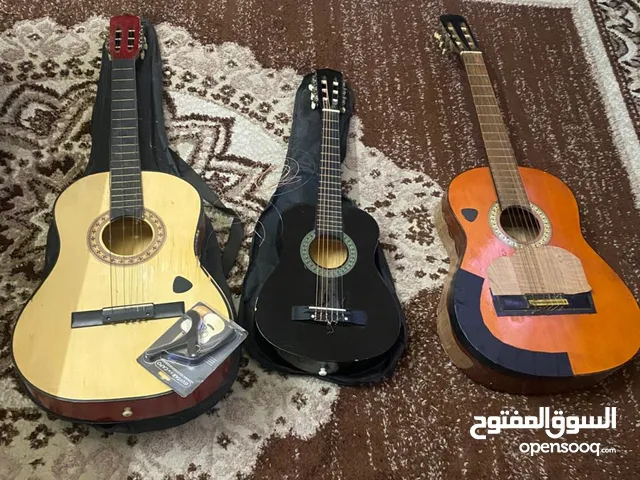 آلات موسيقيه جيتار وعود