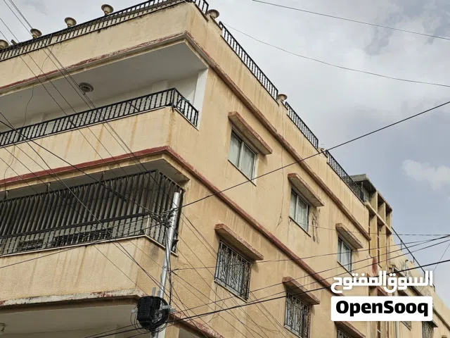 عماره للبيع في الزرقاء حي الإسكان