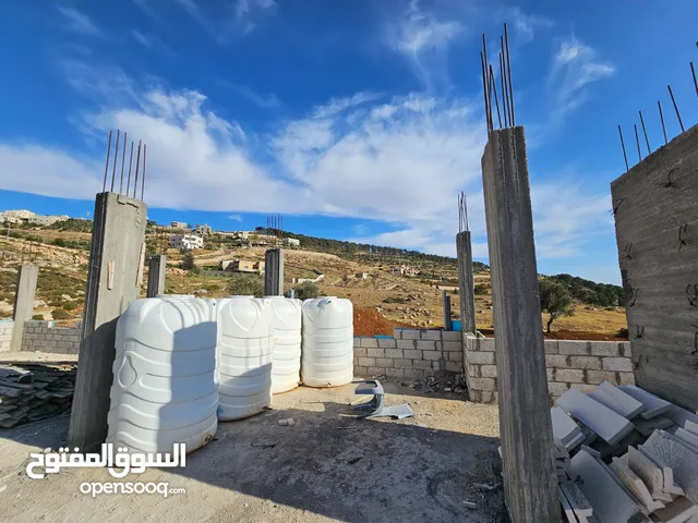 قطعة ارض مع بيت للبيع