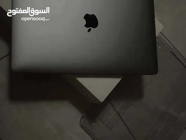 ماك بوك برو مع الكرتون وملحقاته