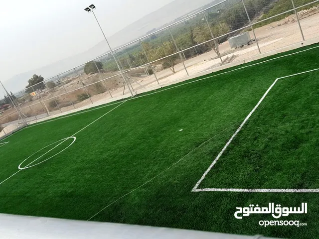 تجهيز ملاعب كرة قدم بالعشب الصناعي معتمد