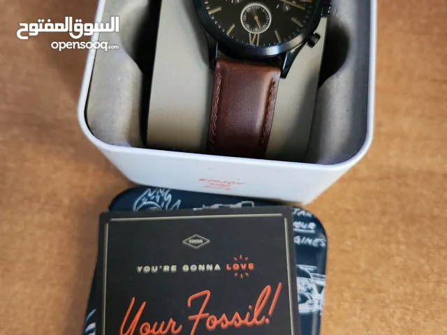 Brown and Black Fossil watch