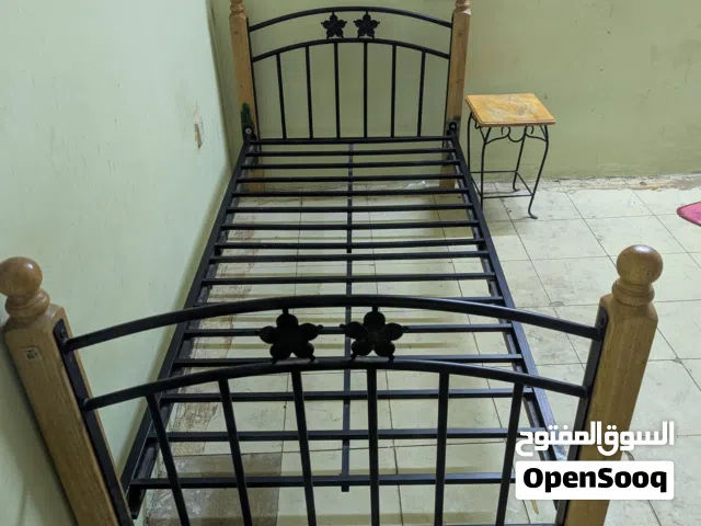 Single bed Hard metal and small table