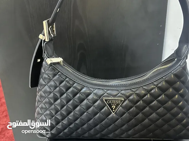 حقيبة Guess مستخدمة مرتين تنفع هدية جلد اسود