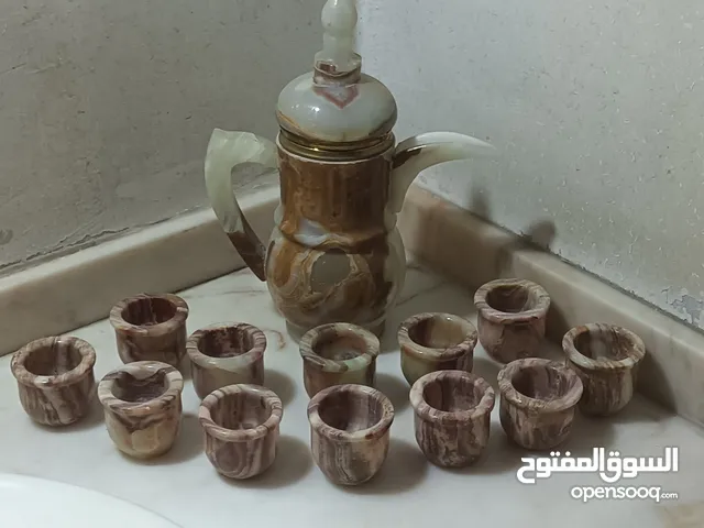 طقم دله و12فنجان من الرخام الخالص الطبيعي صناعه هنديه بالكامل لم تستخدم ابدا