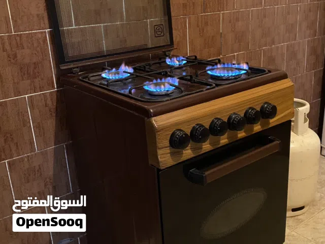 غاز طهي جديد 4 رؤس و كوشة للبيع شغال بحالة ممتازه