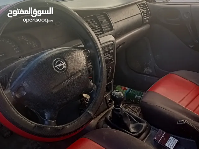 أوبل فيكترا موديل 97 عليها ماتور أسترا مسجل بالرخصه كير عادي خالص ترخيصها من شهر دهان جديد بفهم منفو