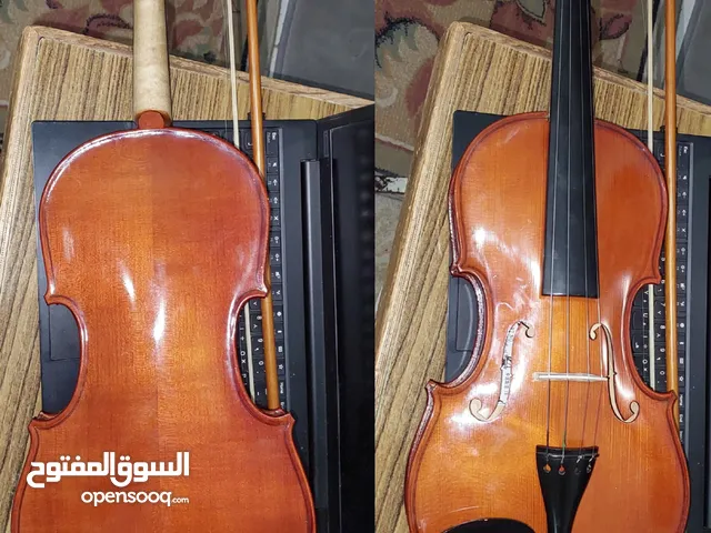 كمان بحالة ممتازة مقاس 4/4 مع القوس صناعة صيني.