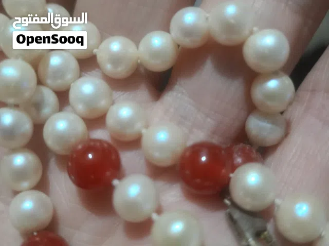 طقم لؤلؤ طبيعي تحفه عقد و انسيال مطعم بفصوص ياقوت و مشبك فضه عيار 925