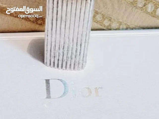 قداحة كريستيان ديور Christian Dior سويسريه اصليه بحالة الوكاله مزينه بحجر كريم ..
