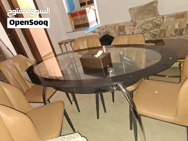 طاولة سفره سيكوريت زجاج مع ست كراسي جلد