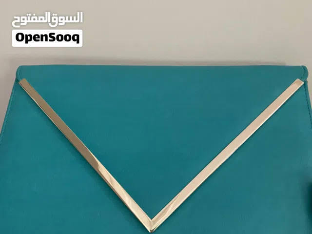 شنتة الدو بسعر مغري 5 دنانير استعمال خفيف جدا بلون التركواز