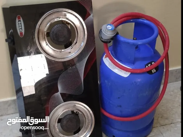 empty gas cylinder with the line and a stove