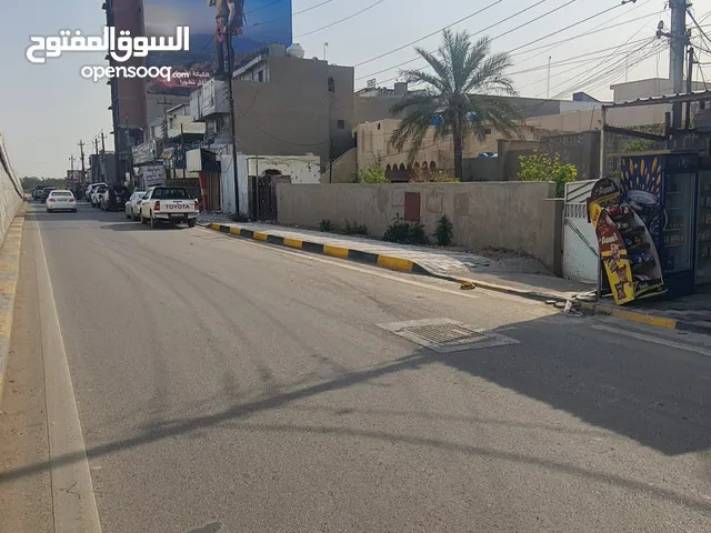 بيت للبيع كقطعة ارض على شارع عام تجاري على الشارع الخدمي لطريق بغداد كربلاء واجهة 20 م مساحة 505م2