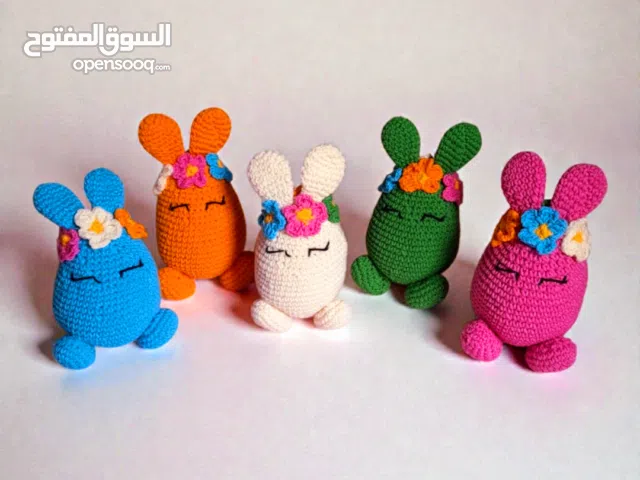 handmade crochet easter bunny egg decor in cream blue pink green and orange