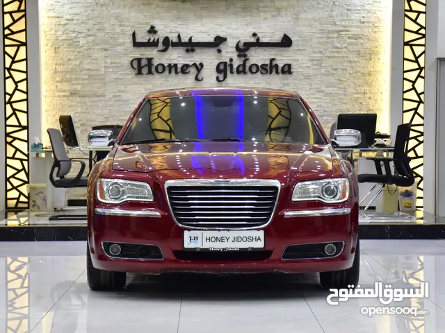 Chrysler 300c ( 2012 Model ) in Red Color GCC Specs This has done a mileage of 133,000 Km